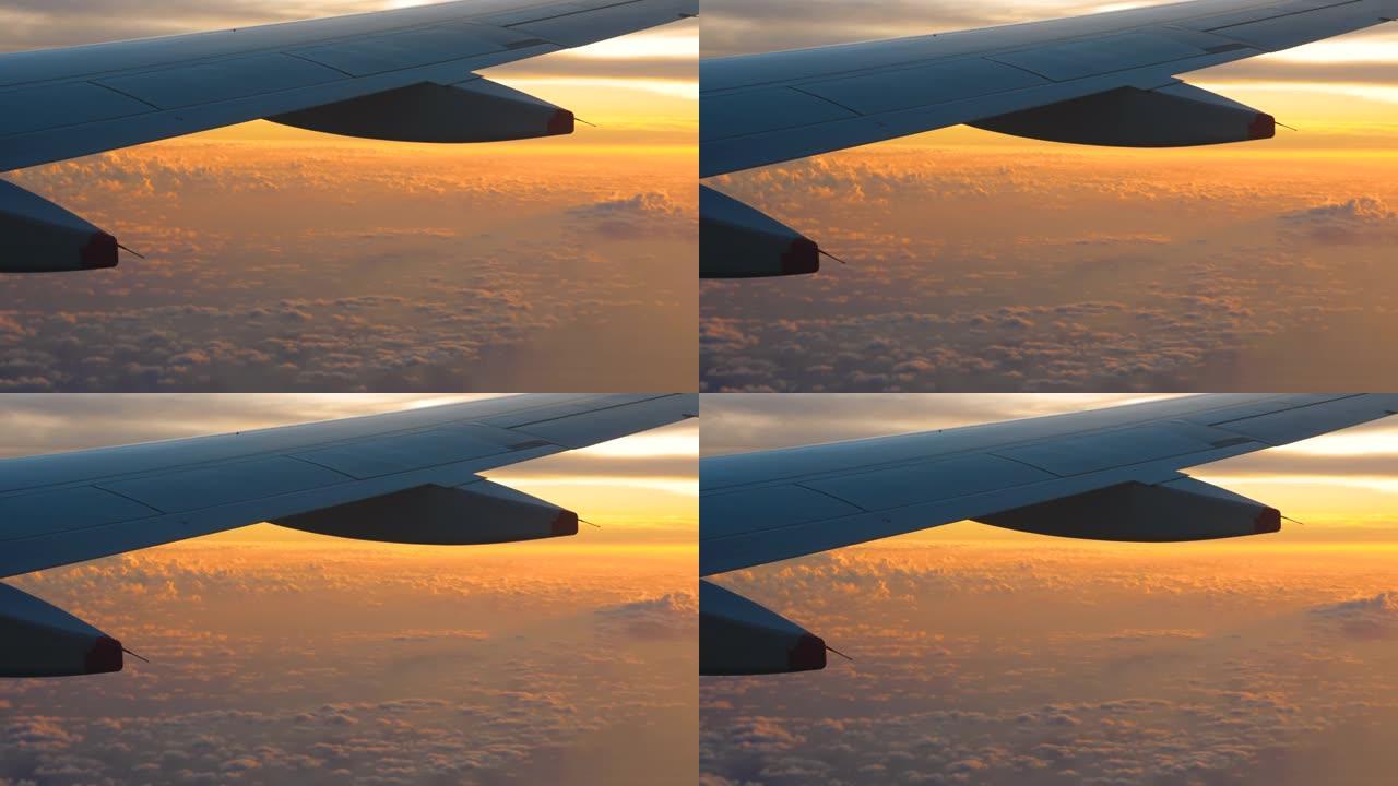 飞机上的日落天空云海高空机翼机舱窗外