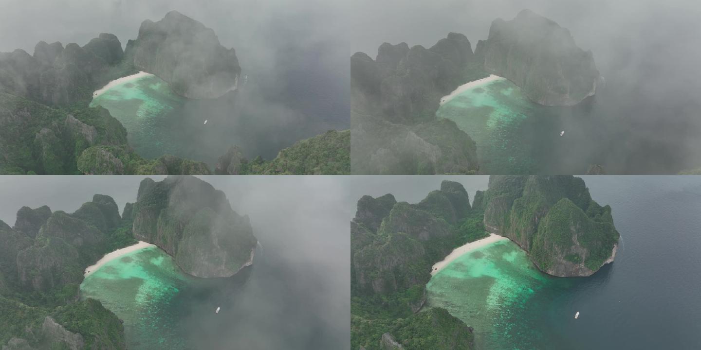 空中无人机从泰国玛雅海滩上空的一片薄薄的云层中射出。