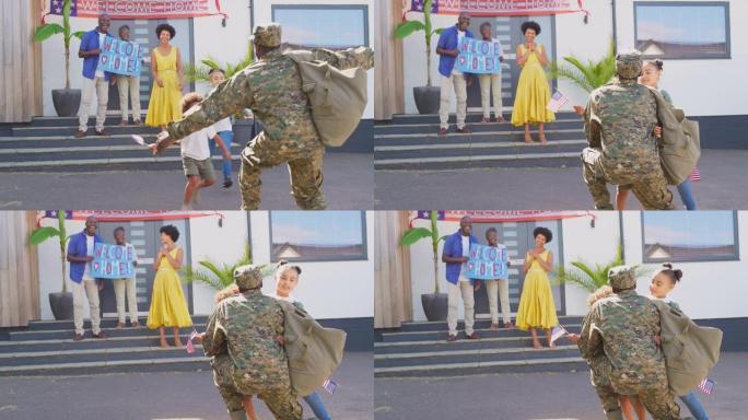 孩子们跑去拥抱爸爸，几代人的家庭用慢动作的横幅镜头欢迎休假的军人父亲回家
