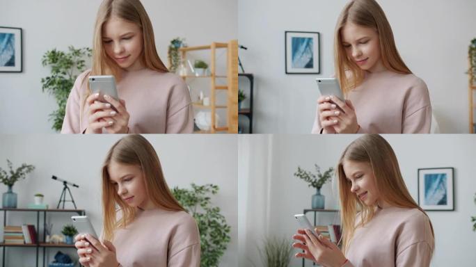 在家中使用智能手机触摸屏的快乐少女的慢动作肖像