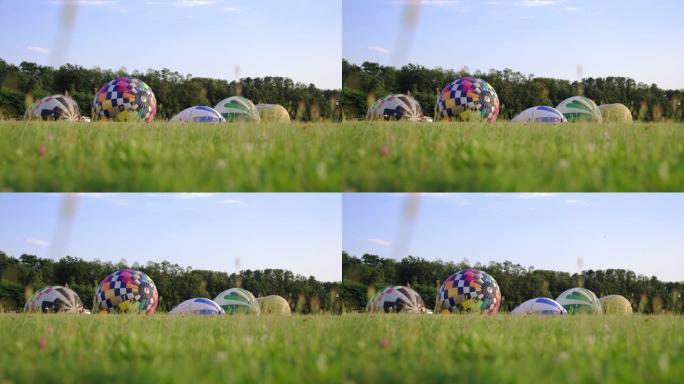 慢动作充气热气球草地上的热气球视频素材公