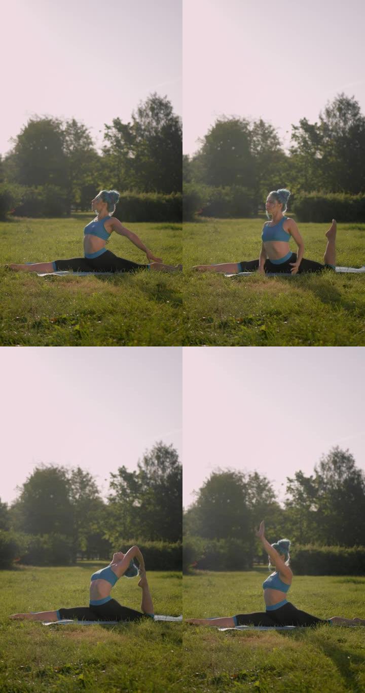垂直视频，一位迷人的健身瑜伽老师穿着绿松石的头发，穿着绿松石的瑜伽服装，用弯曲的后腿做纵向麻线