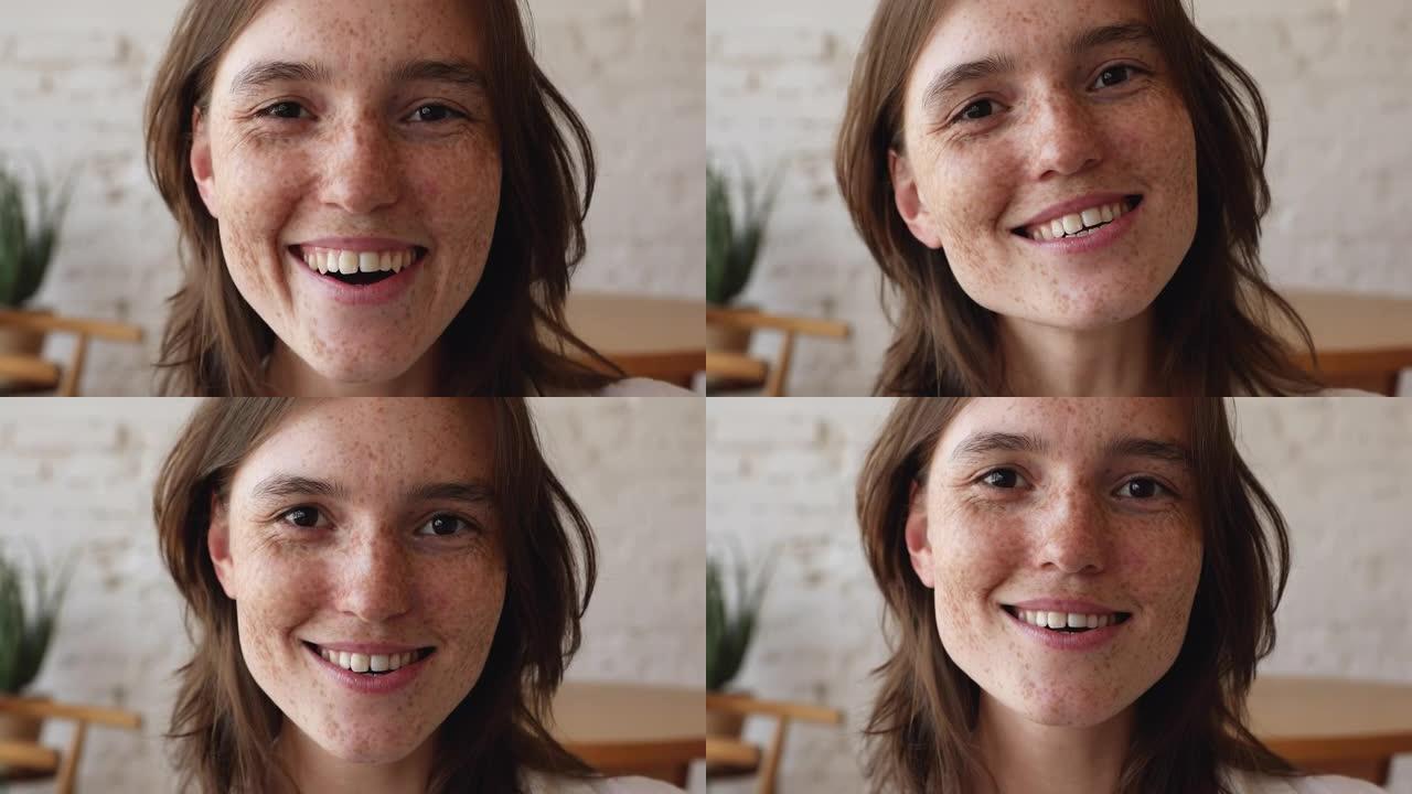 十几岁女性微笑的漂亮雀斑脸特写肖像