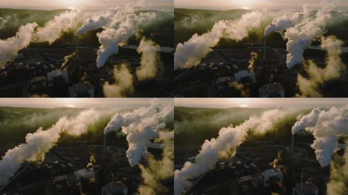 污染。气候变化。环境破坏。日出时许多烟囱排放的温室气体的壮观鸟瞰图