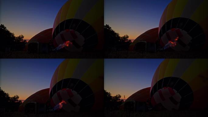 丙烷火焰在黎明时在野外充气热气球