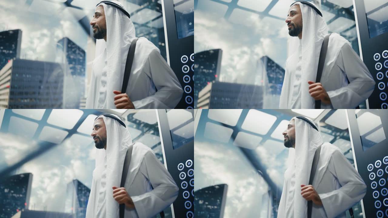 成功的快乐穆斯林商人在传统的白色坎杜拉骑玻璃电梯到现代商务中心的办公室。沙特、阿联酋、阿拉伯商人概念