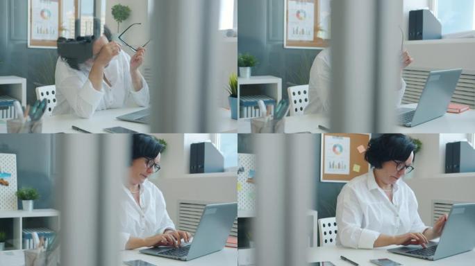 疲惫的女商人脱下眼镜，头痛，在办公室用笔记本电脑工作