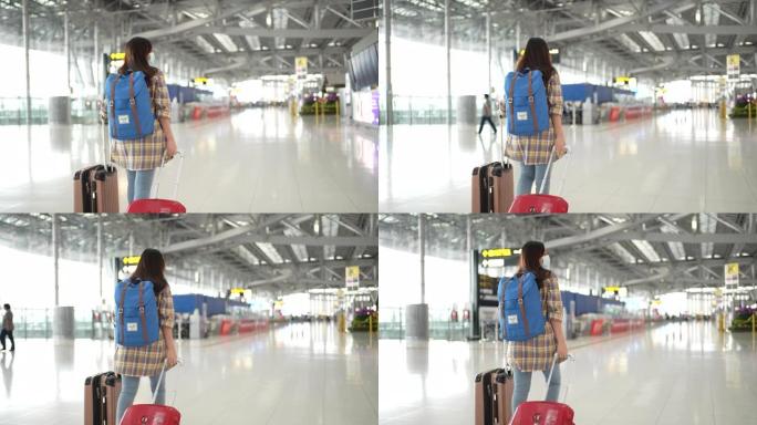 亚洲旅游妇女走过机场航站楼在机场旅行