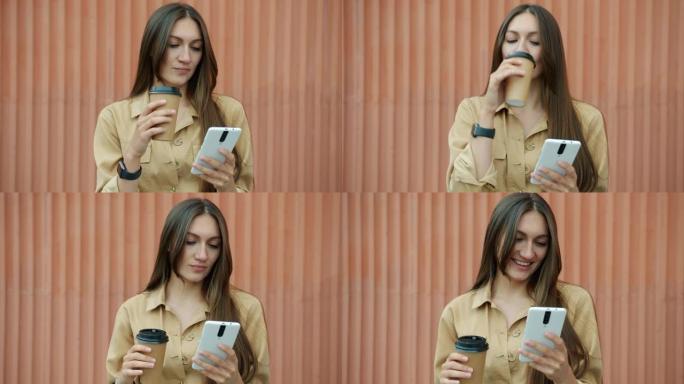 无忧无虑的女孩使用智能手机笑着喝户外带走咖啡