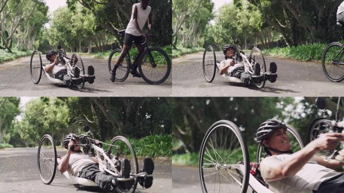 4k视频片段，一个成熟的截瘫患者在与朋友一起骑自行车穿越森林时使用手动自行车