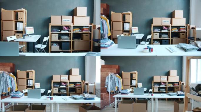 现代非营利组织办公室，捐款箱装满了慈善用的旧衣服