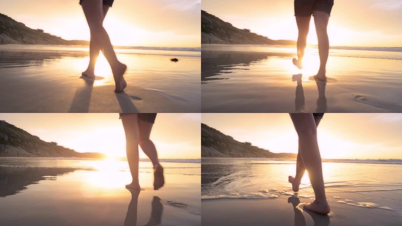 一名妇女在海滩上漫步的4k录像