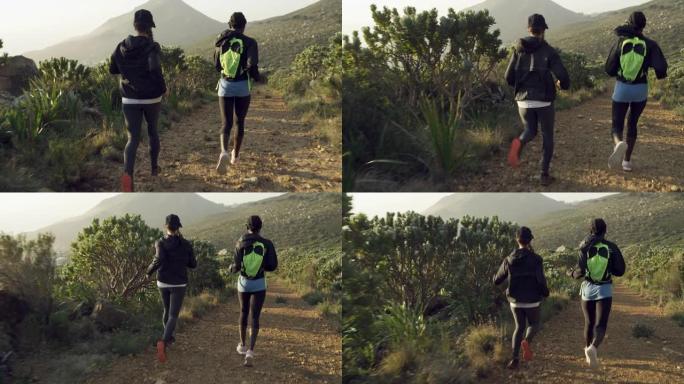 两名年轻妇女在山路上奔跑的4k录像
