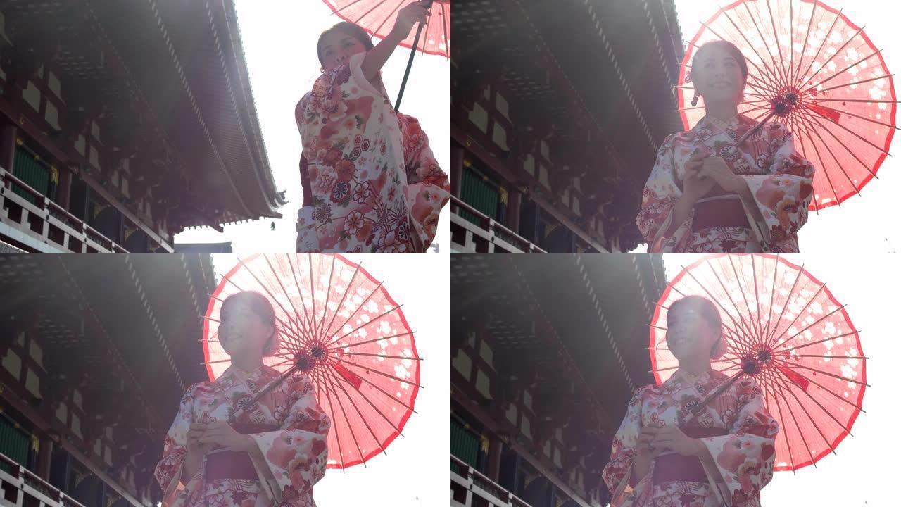 穿着传统的日本和服打开雨伞