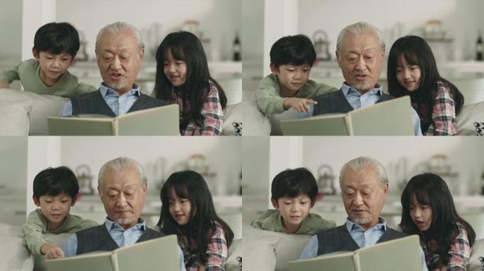 亚洲祖父向两个孙子讲故事