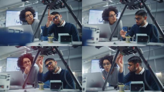 成功创业: 黑人男性工程师在无人机设计公司工作时向女性开发人员讲述他的想法。人们设计无人机概念。慢动