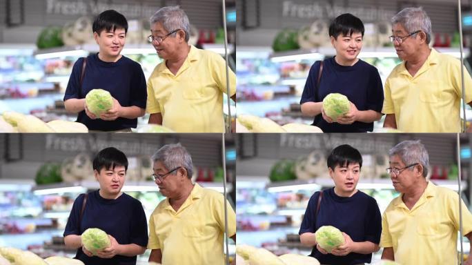 一位亚裔华裔活跃老人与女儿逛街挑选白菜
