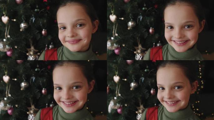 圣诞树上的微笑女孩特写