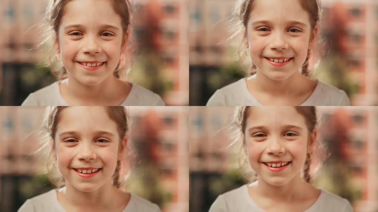 特写一个可爱的小女孩的肖像，棕色的眼睛和头发看着相机，开心地微笑。聪明的天才女孩在家里笑着玩得开心。
