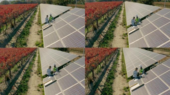 太阳能，无人机和农场工程团队的鸟瞰图检查太阳能电池板，维护或安装。太阳能农场平板电脑上的清洁能源，可