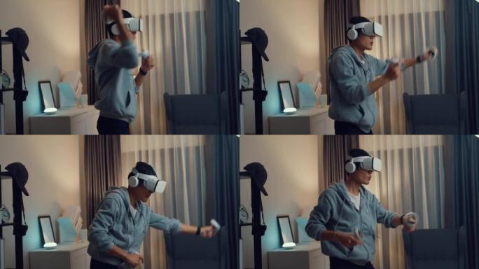 年轻的亚洲男子游戏玩家穿着灰色连帽衫，配有虚拟现实oculus手持虚拟现实操纵杆控制器，晚上体验游戏