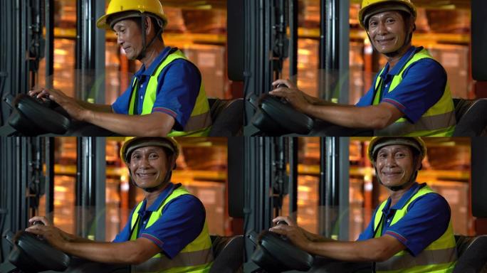 手持肖像: 亚洲男性叉车操作员微笑。