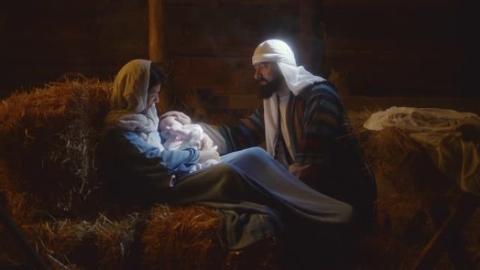 约瑟夫在谷仓里与玛丽和婴儿耶稣交谈