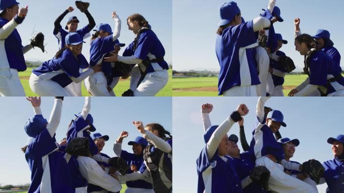 快乐的多元化女子棒球运动员团队在赛后庆祝，举起一名球员