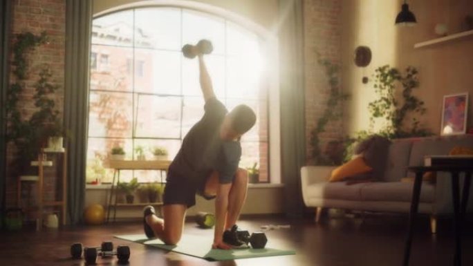 适合运动强壮的年轻人训练和加强手臂肌肉在晨练期间在阳光明媚的公寓。健康生活方式和健身理念。