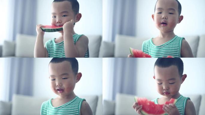 亚洲男婴吃西瓜特写展示小胖孩吃