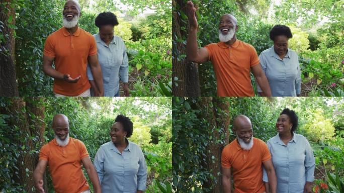 非裔美国老年夫妇在花园里一起散步时手牵着手微笑