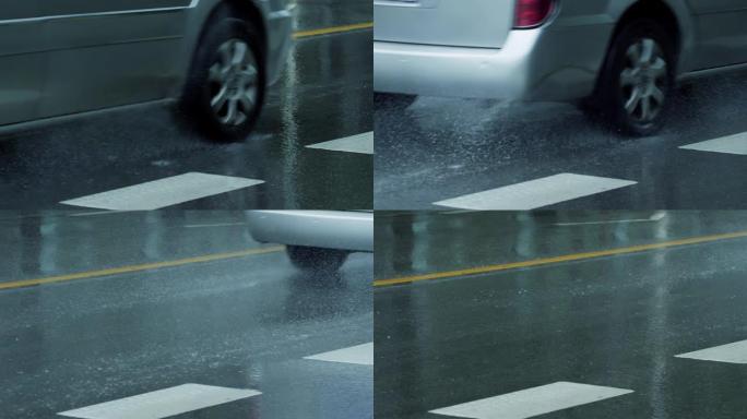 在雨天街道上行驶的慢动作汽车
