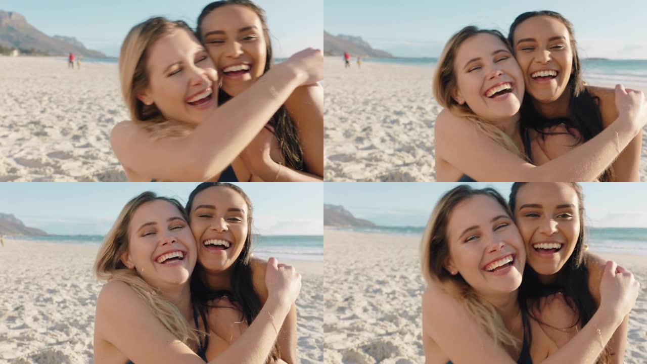 美丽的女人在海滩上拥抱女朋友，在脸颊上亲吻惊喜最好的朋友玩得开心暑假