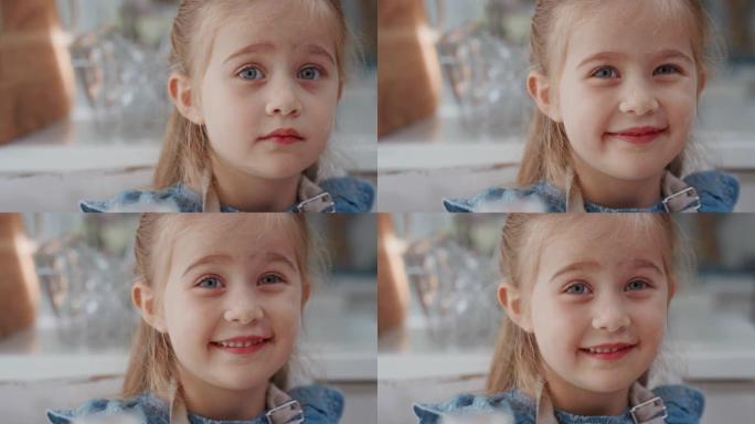 肖像可爱的小女孩微笑着看着快乐的孩子，带着天真俏皮的表情4k镜头