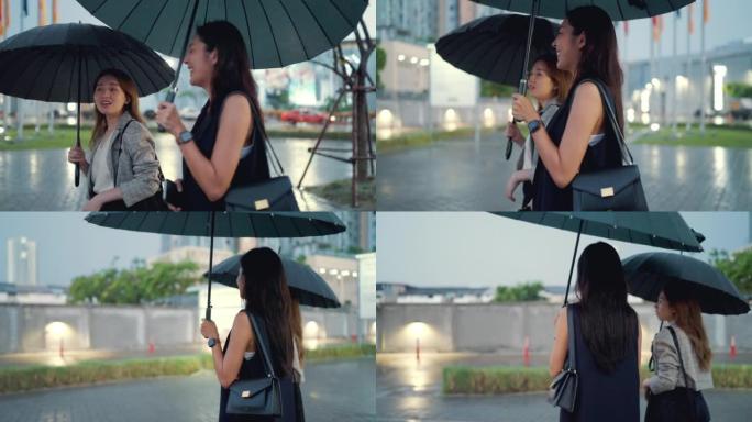 大雨中，两名亚洲妇女正在回家的路上。