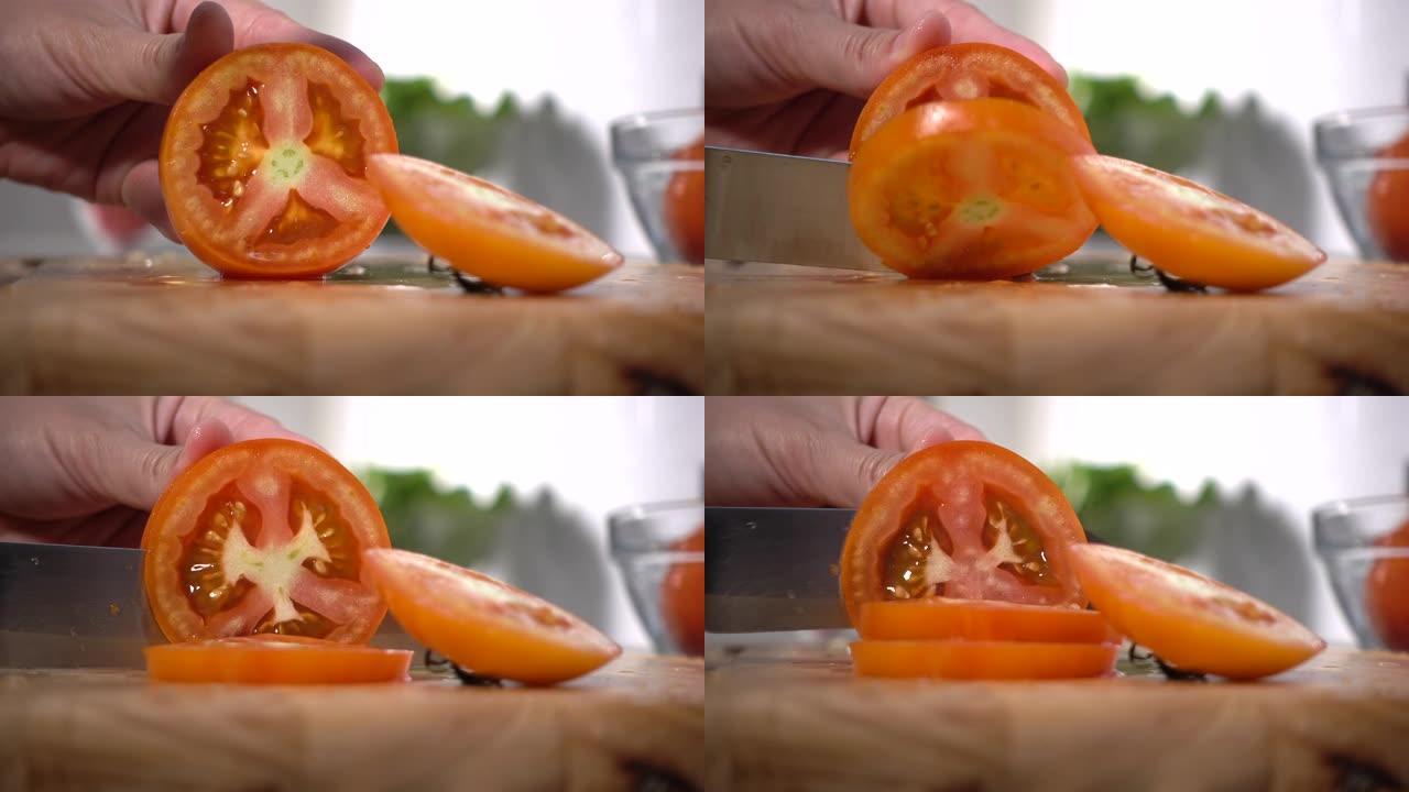 女人的手切番茄果子切开西红柿小刀案板