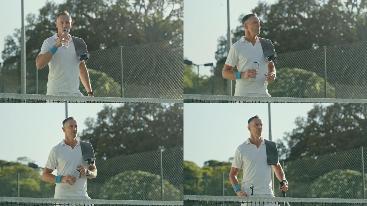 成熟的网球在网球场上喝水