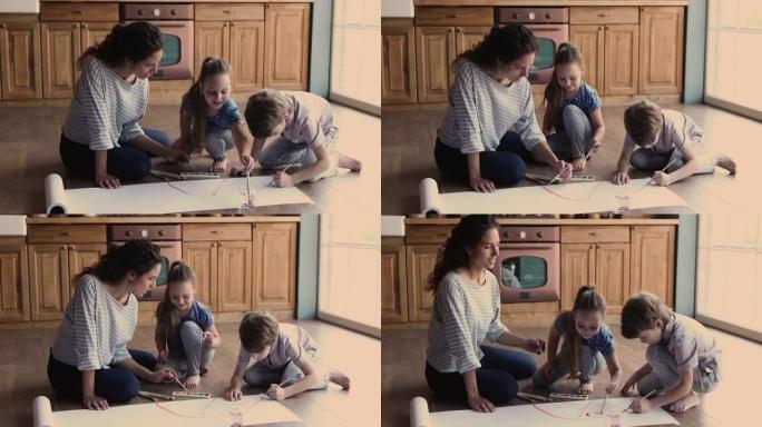快乐妈妈和小孩在室内画画。
