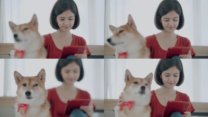 年轻女子与柴犬在卧室休息