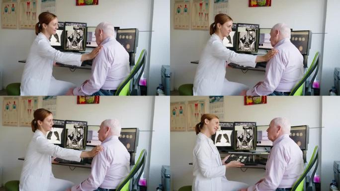 医生使用数字平板电脑与一名高级男子讨论脑部扫描