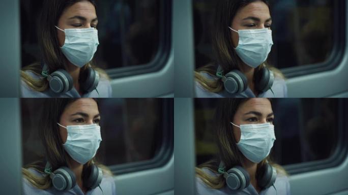 晚上坐在火车上，戴着医用口罩的年轻疲惫的女人思考。辛勤工作的员工乘坐公共交通工具回家的工作日结束，尊
