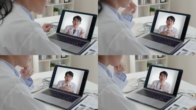 亚洲医生会议在办公室计算机上进行视频电话会议。