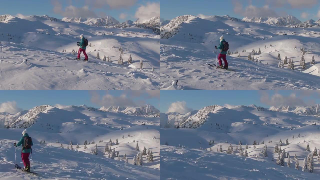 无人机: 在Velika Planina进行女子滑雪之旅时，雪谷的壮观镜头。