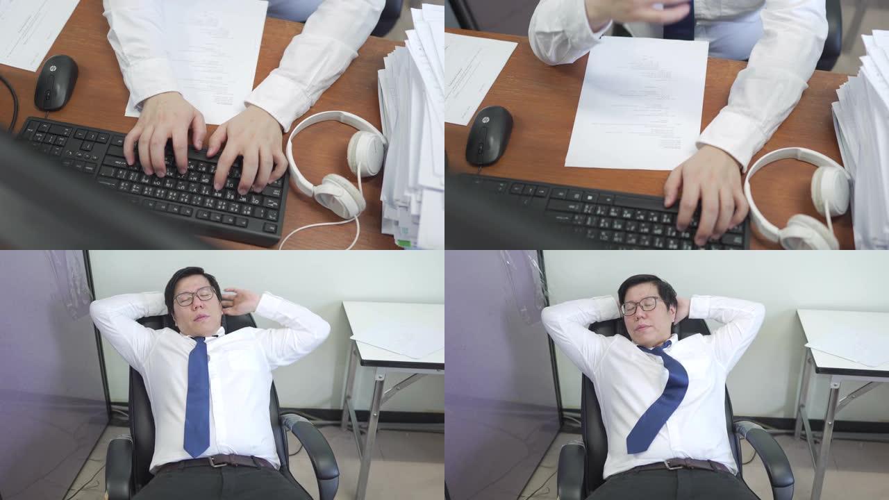 亚洲男子睡在工作场所，办公室