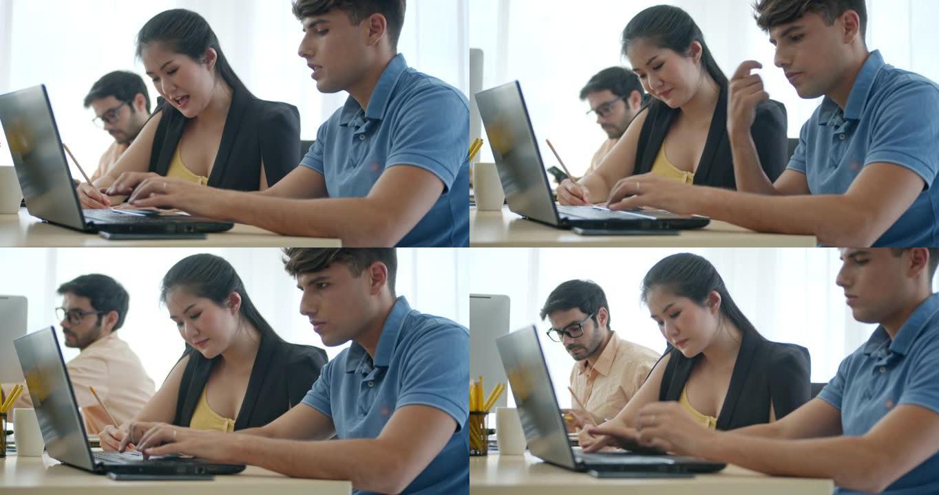 一群在现代办公室使用电脑的同事
