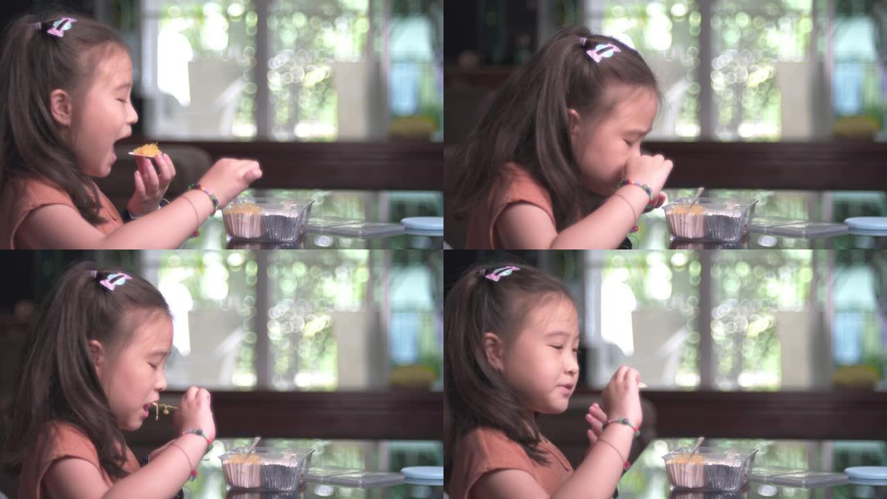 吃泰国甜点的亚洲小女孩
