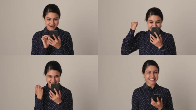情绪激动的年轻印度妇女庆祝网上彩票中大奖。