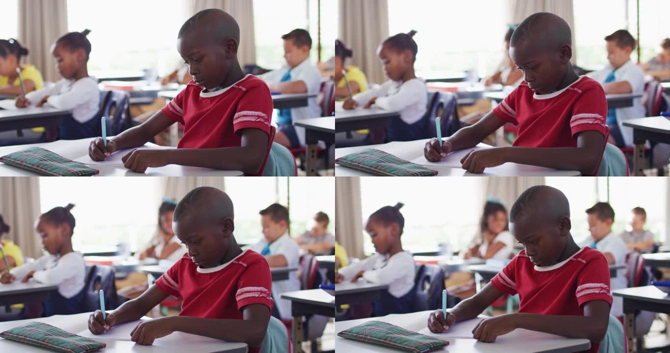 坐在教室里做笔记的非洲裔美国小学生的肖像