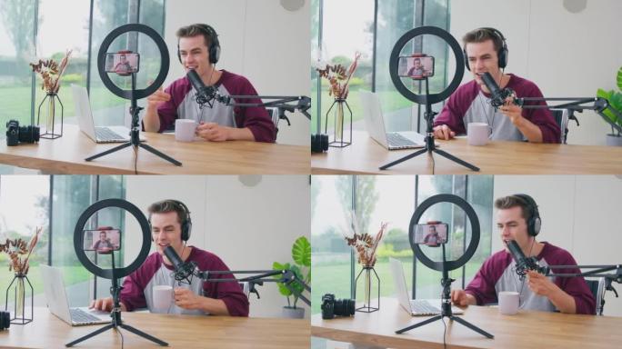 男性Vlogger戴耳机带麦克风手机直播