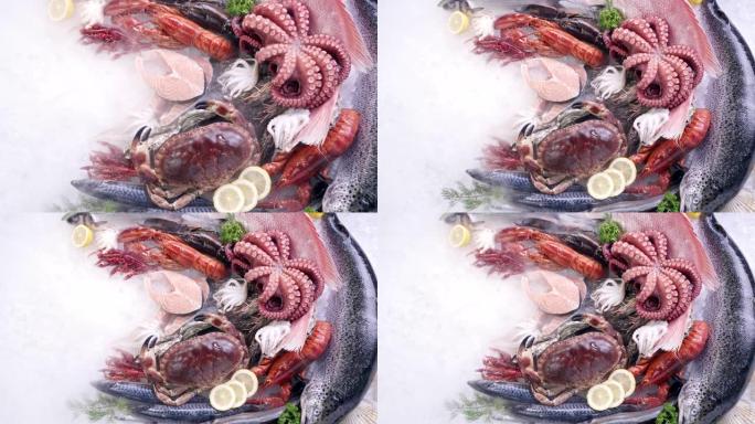 4K UHD缩小俯视图: 各种豪华新鲜海鲜，龙虾鲑鱼鲭鱼小龙虾对虾章鱼贻贝和扇贝，在冰背景下冷冻冰冷